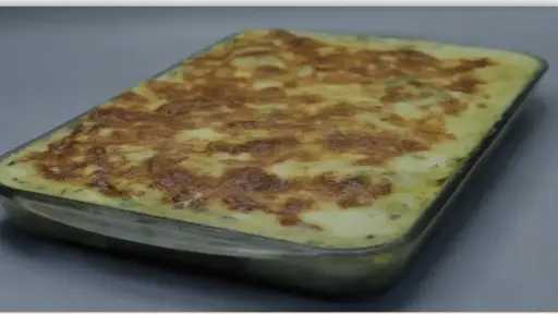 طاجن السمك بالبشاميل والخضروات.. وصفة مبتكرة لعشاء شهي ومغذي